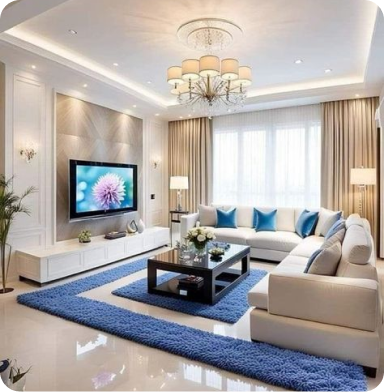 Living room with a modern TV setup and white furniture